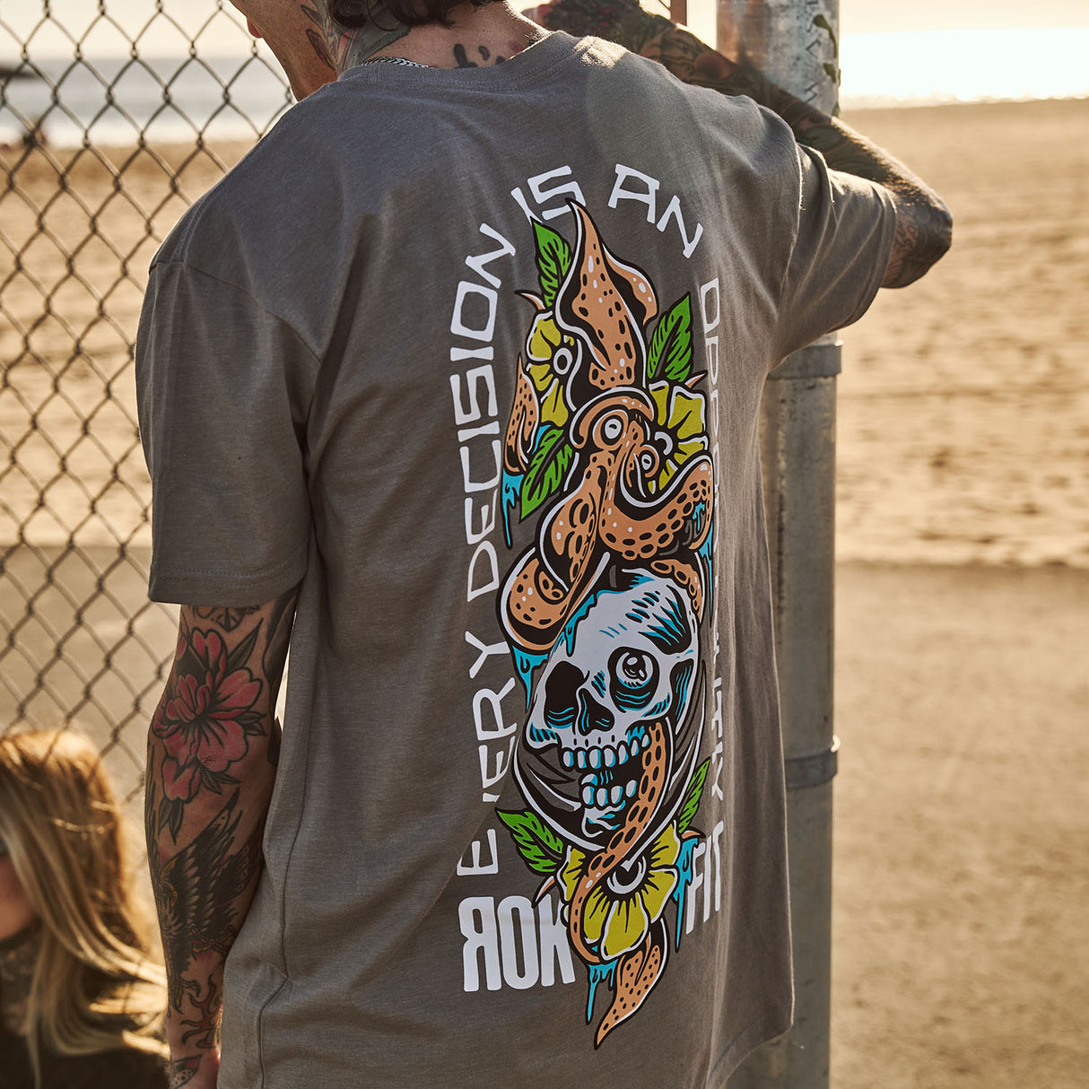 Male model outdoors wearing unisex Active Tee with 'Every Decision' graphic