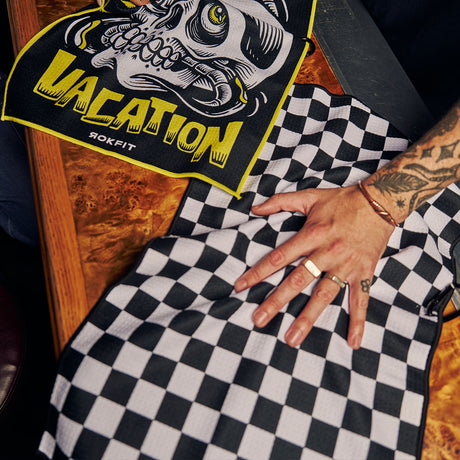 Male model using Utility Towel on bar top with 'Checker' graphic