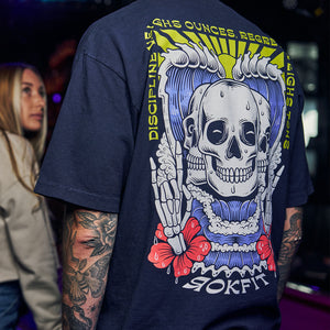 Male model in bar wearing navy blue Street Tee with 'Discipline Weighs Ounces, Regrets Weighs Tons' graphic