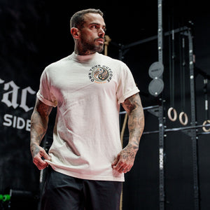 Male model in a gym wearing Street Tee with 'Excuses or Reasons' graphic